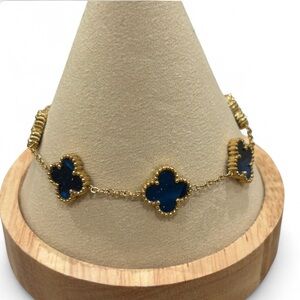 Elegant Gold and Black Clover Bracelet